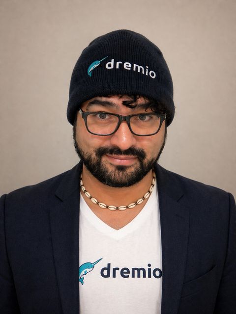 Alex Merced — professional headshot, Dremio tee and blazer